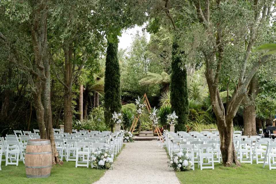 Olive tree-lined garden ceremony aisle at Markovina Vineyard Estate